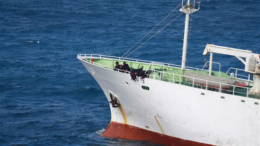 Crew of illegal fishing vessel paint a new name on the hull